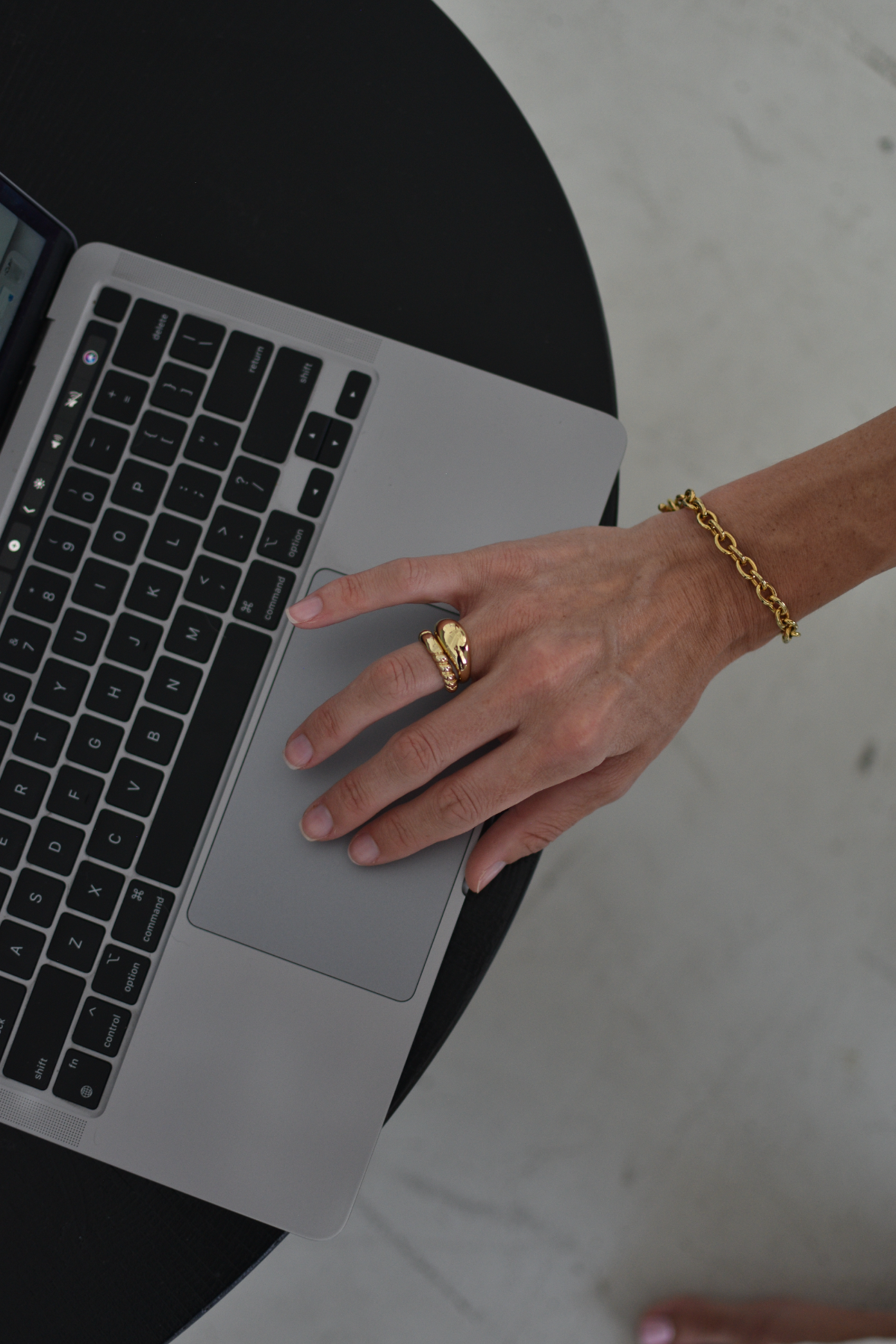woman using laptop, screen is out of the frame