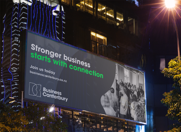 BIllboard at night showing Business Canterbury's brand campaign