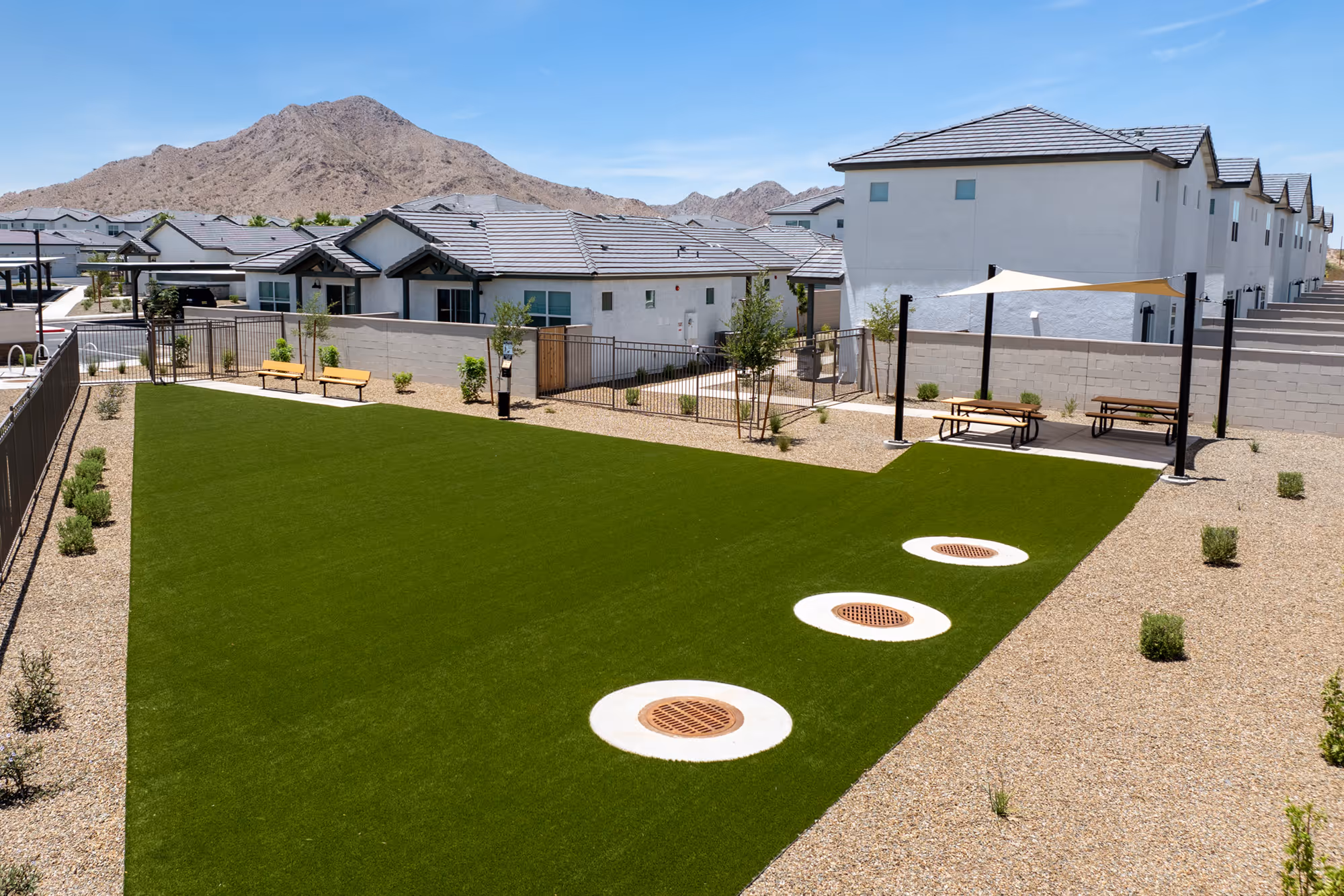 Dog park with benches and shaded seating area