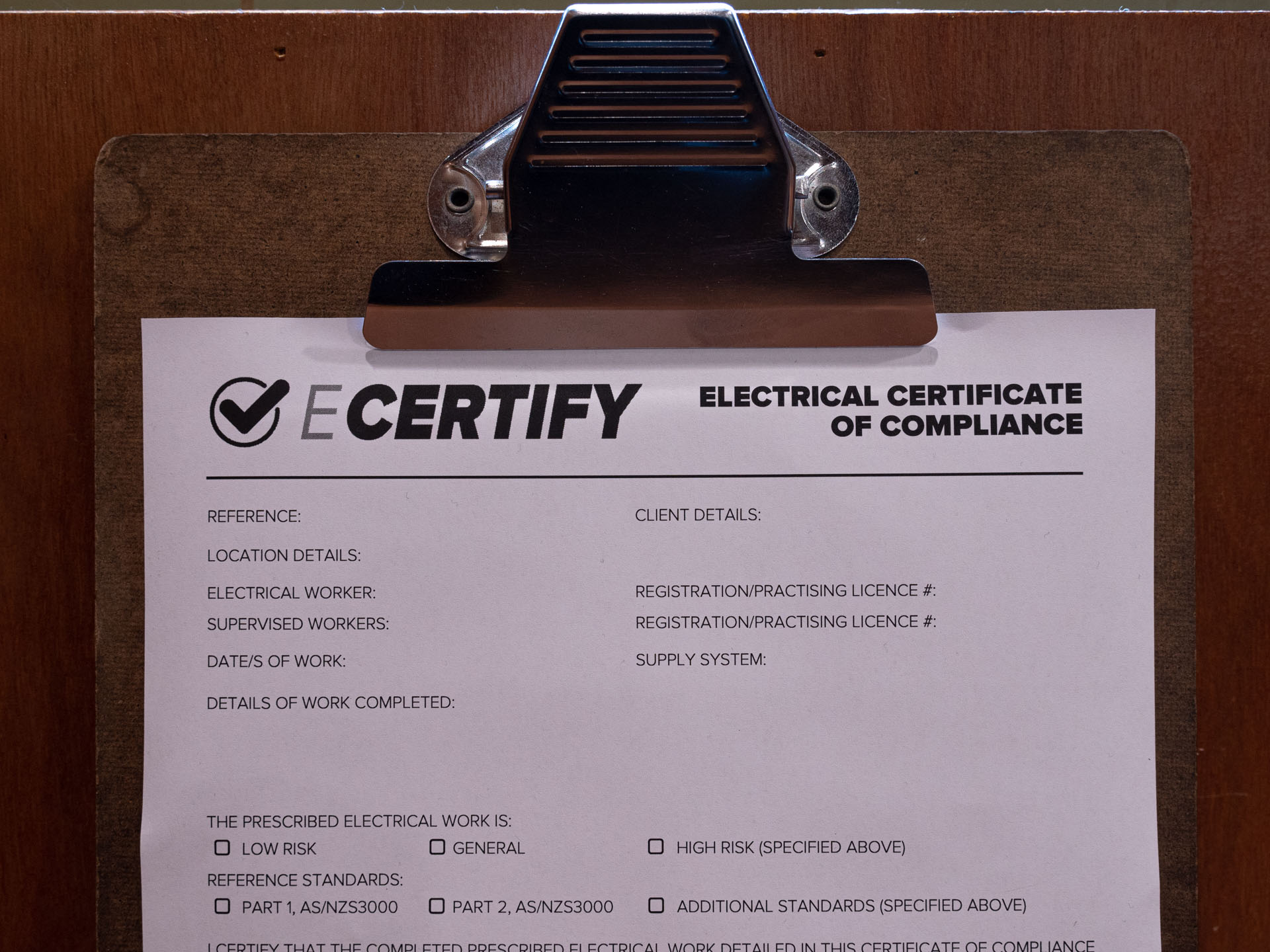 An eCertify Certificate of Compliance on a clipboard