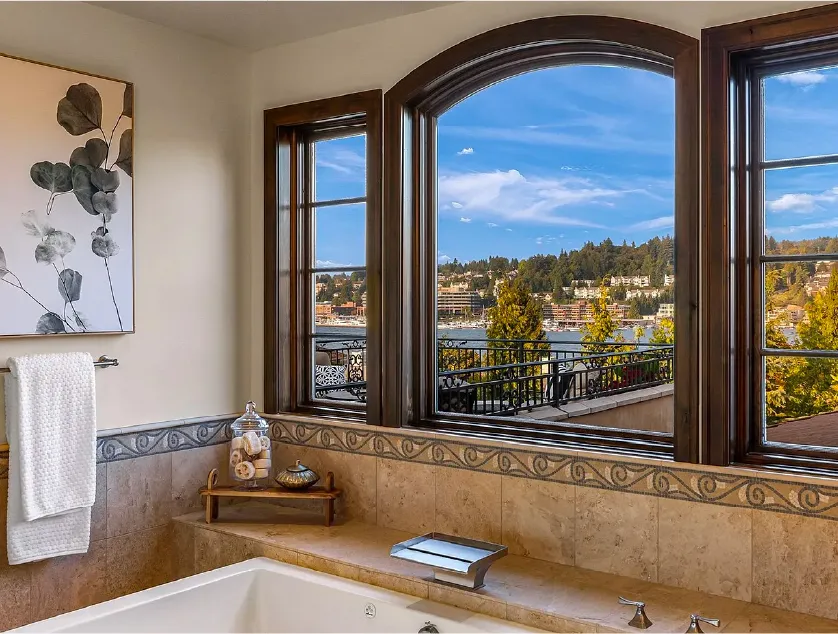 custom designed bathroom by burke gibson llc overlooking lake