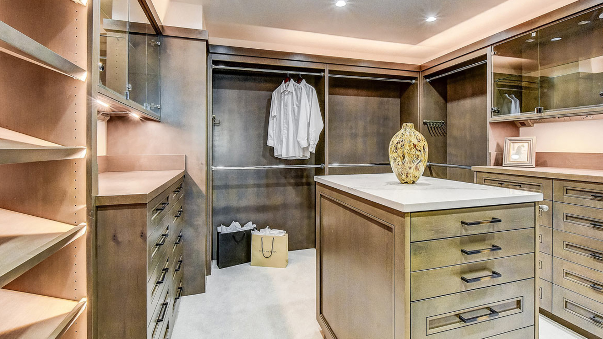walk in closet designed, fabricated and isntalled with quality millwork and detail