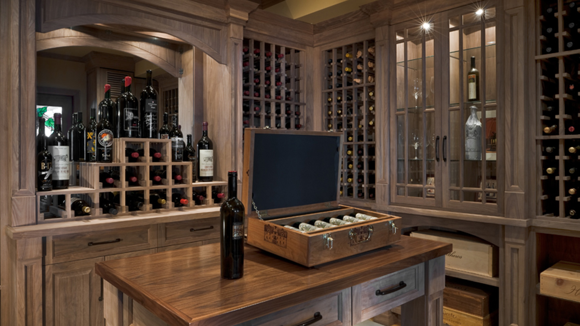 custom designed wine bar designed, engineered and fabricated by burke gibson with wine bottles