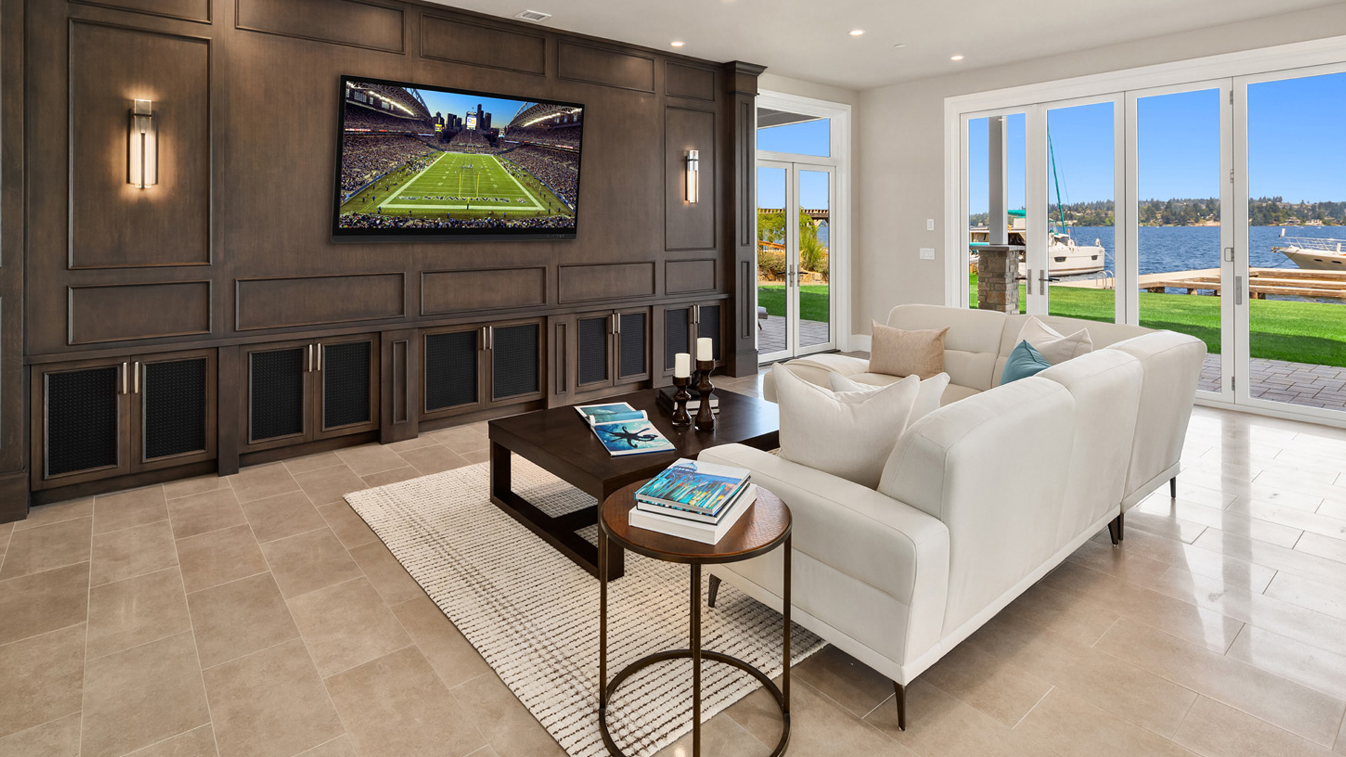 custom designed entertainment center by burke gibson llc in bonus room with couch on the lake edge