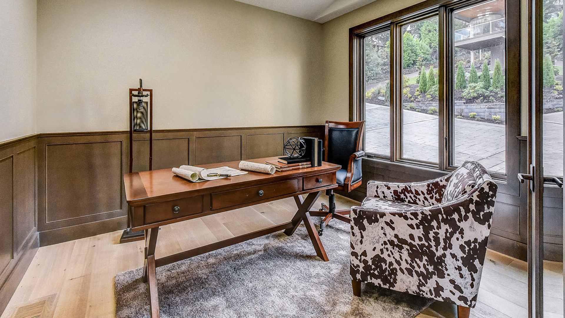 custom designed home office with open windows overlooking late