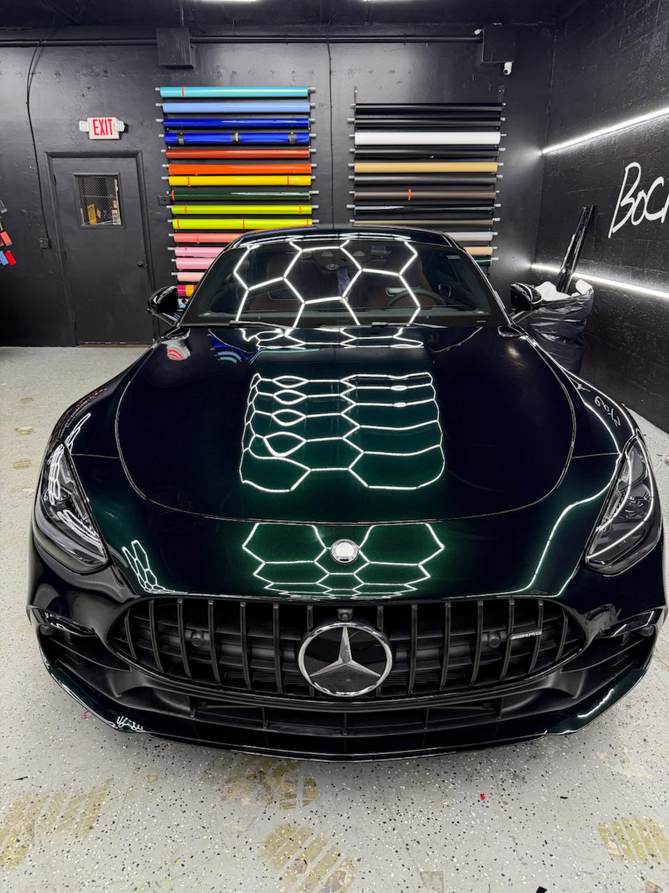 Dark green Mercedes-AMG GT at the Wrap Me USA Miami color wall