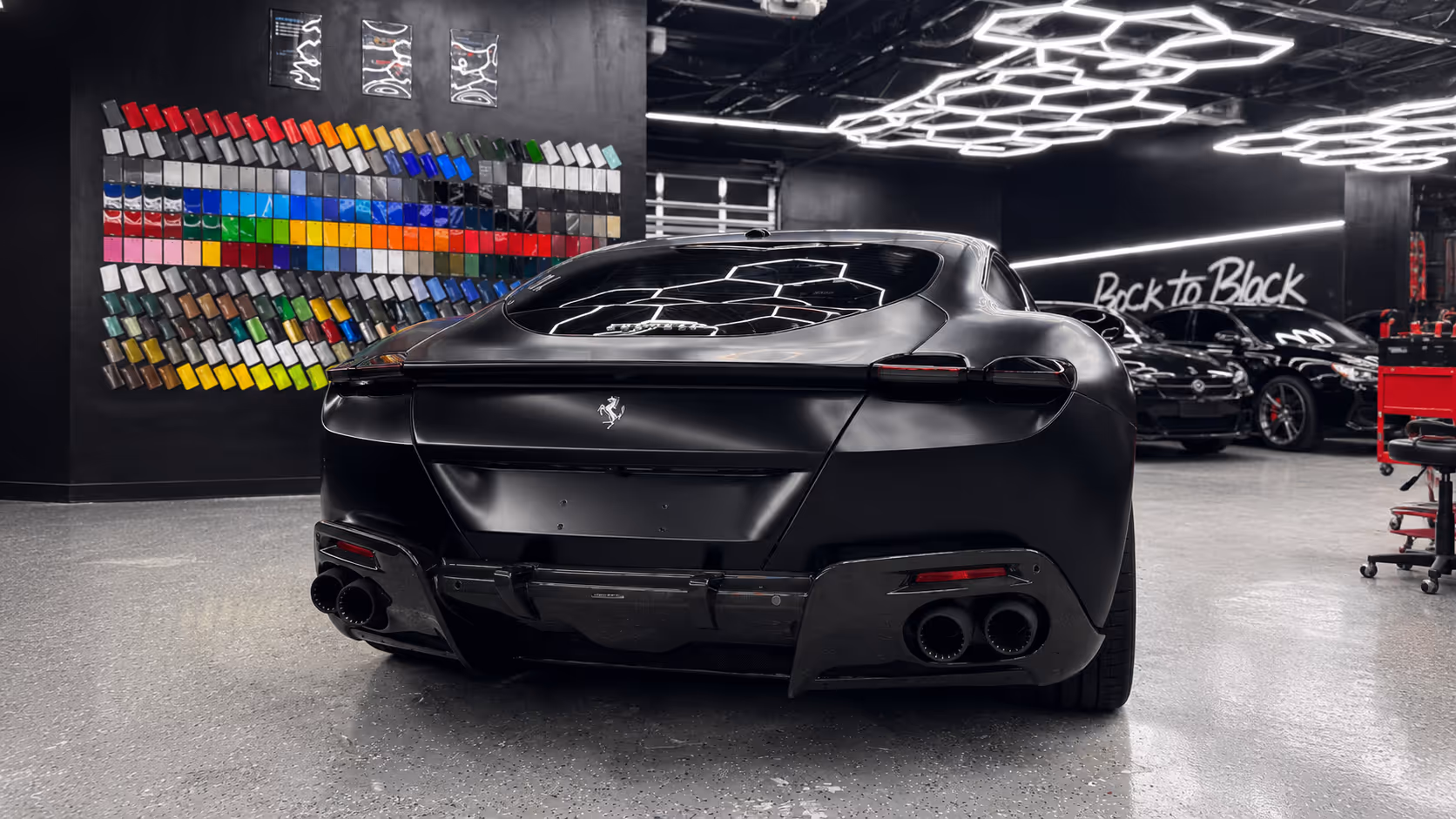Satin black chrome delete on a luxury car at Wrap Me USA's Miami studio