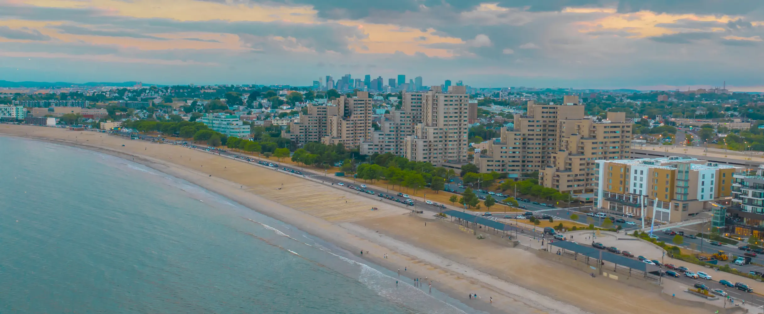 Aerial view of a coastal city with a bridge over the water.