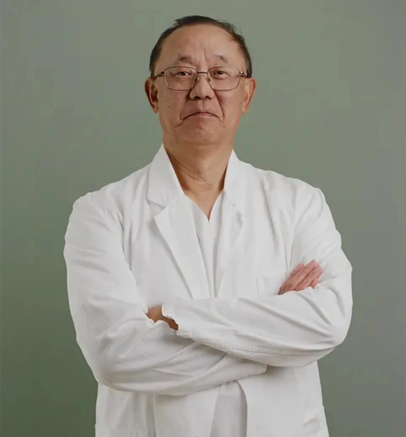Dr. Zhengwu Sun, a middle-aged man wearing glasses and a white medical lab coat, standing with arms crossed in a professional portrait pose.