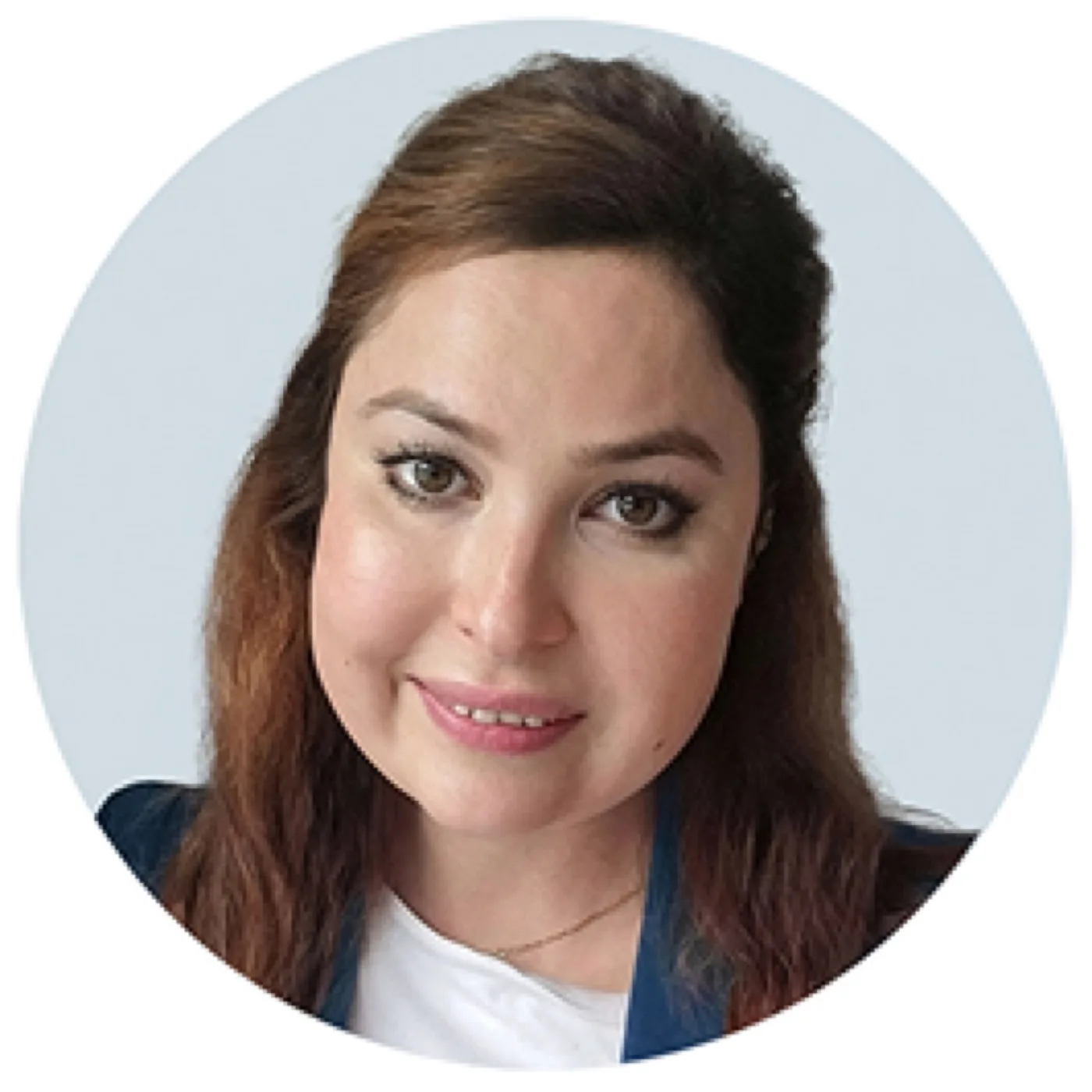Circular profile photo of Dr. Amal Makansi, a woman with long auburn hair, hazel eyes, and a warm smile, wearing a white top and a blue blazer.