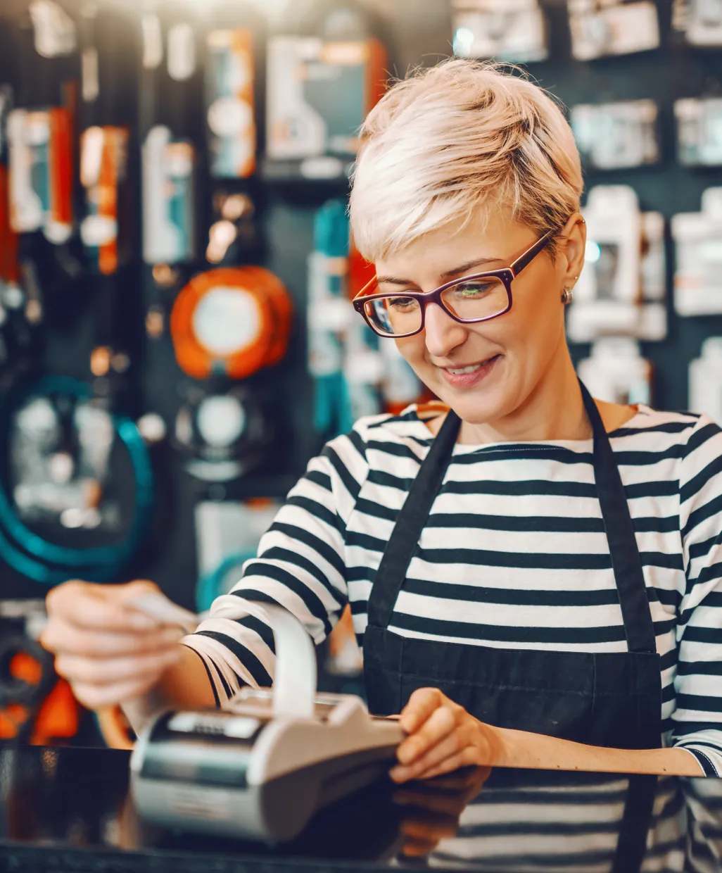 Business owner processing a payment with Firstrust merchant services