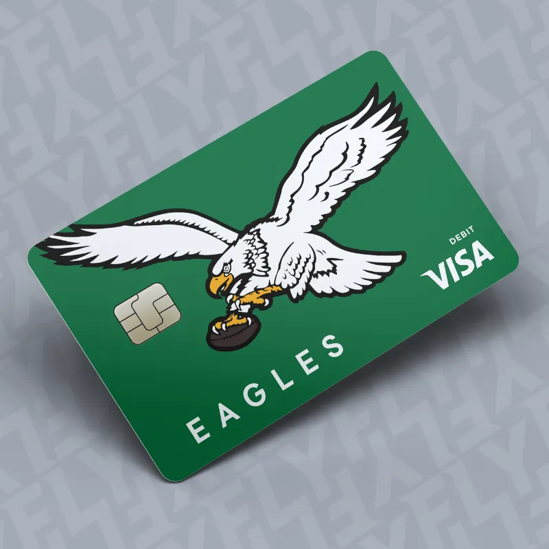 Green Visa debit card with a white eagle holding a hockey puck and the word EAGLES.