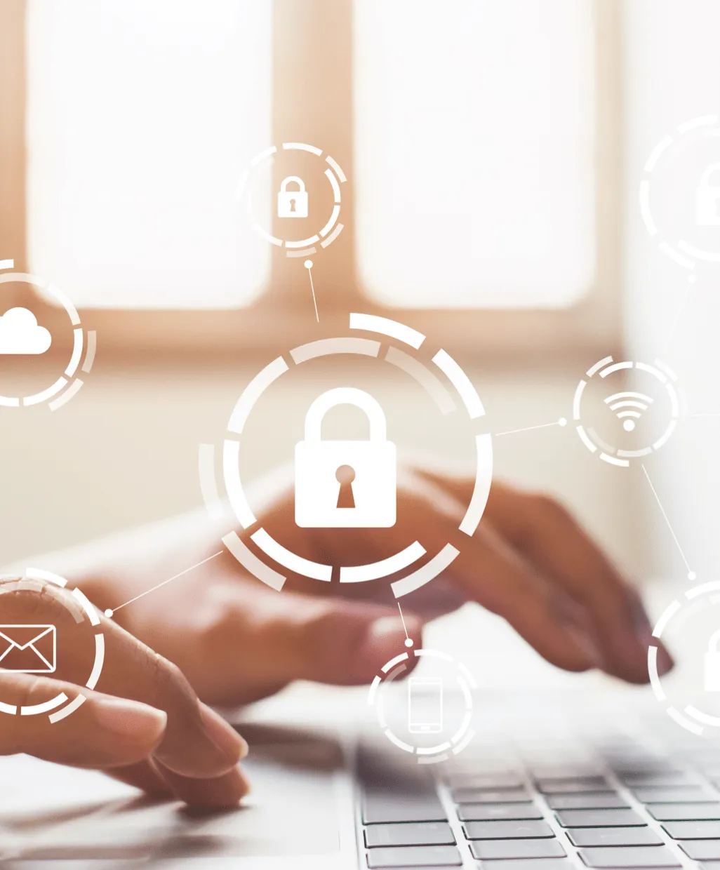 Hands typing on a laptop keyboard with digital icons of locks, cloud, email, and wifi overlayed.