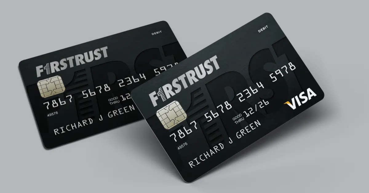 Two black FirstTrust debit cards with chip, card number, name Richard J Green, and VISA logo visible.