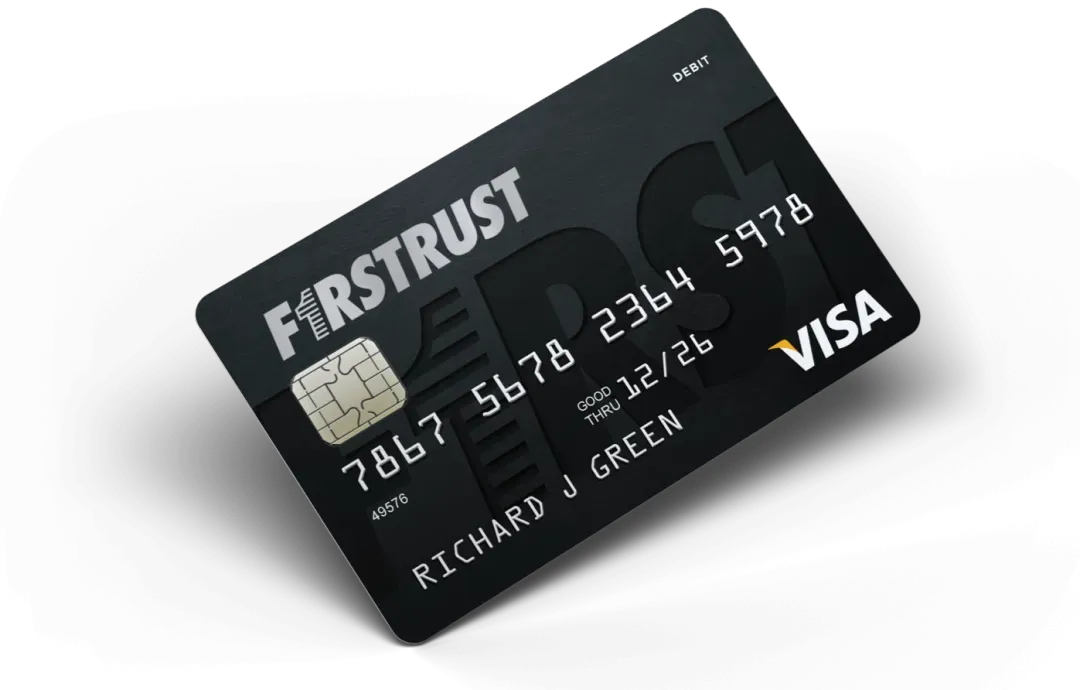 Black Visa debit card from Firstrust with chip, card number, expiration date, and name Richard J Green.