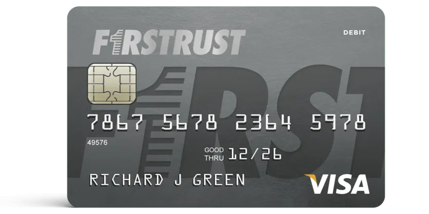 Gray First Trust Visa debit card with chip, card number, expiration date, and name Richard J Green.