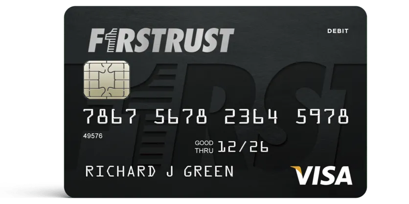Black Firstrust Visa debit card with chip, card number, holder's name, and expiration date 12/26.
