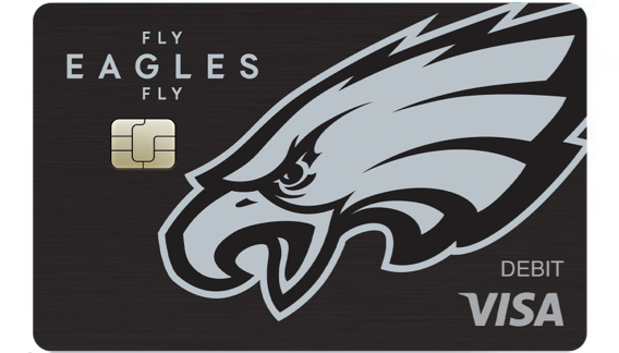 Black debit card featuring a silver Philadelphia Eagles logo and text reading 'Fly Eagles Fly'.