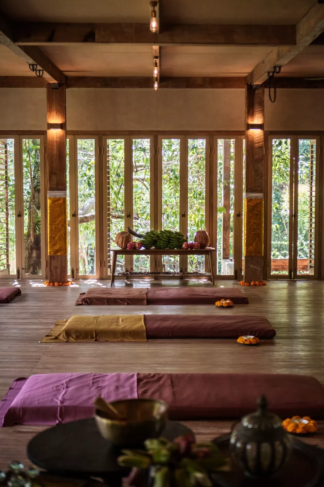 Meditation mats, cushions, and sound healing bowls prepared for a private session inside The Shaba Shala.