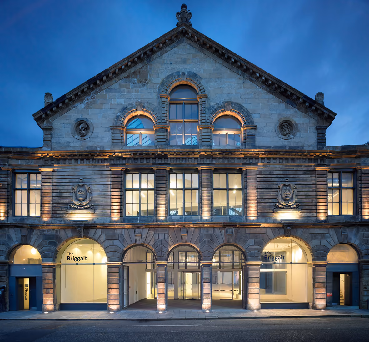 The historic Briggait building in Glasgow illuminated at dusk