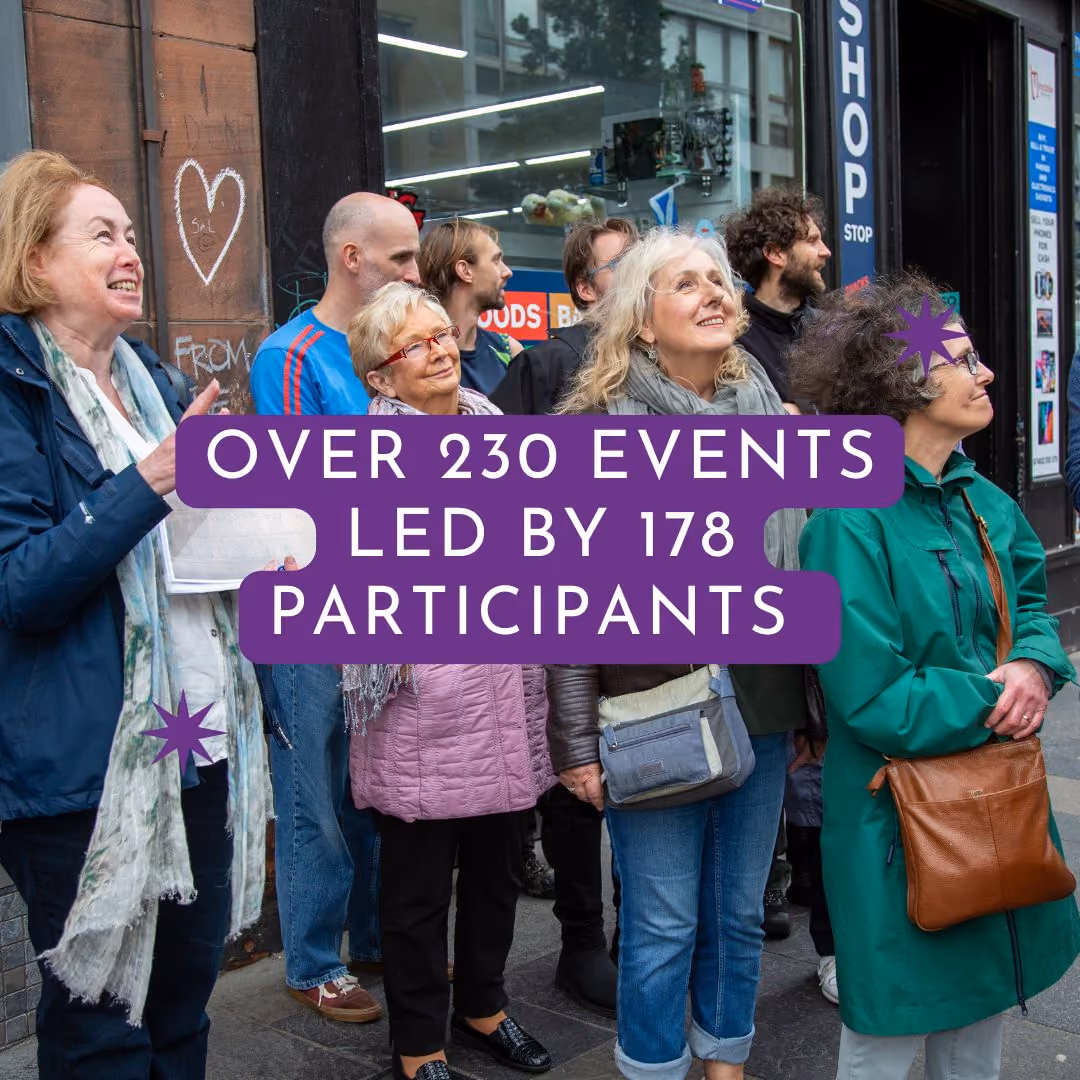 Group of people participating in a community event on a city street.