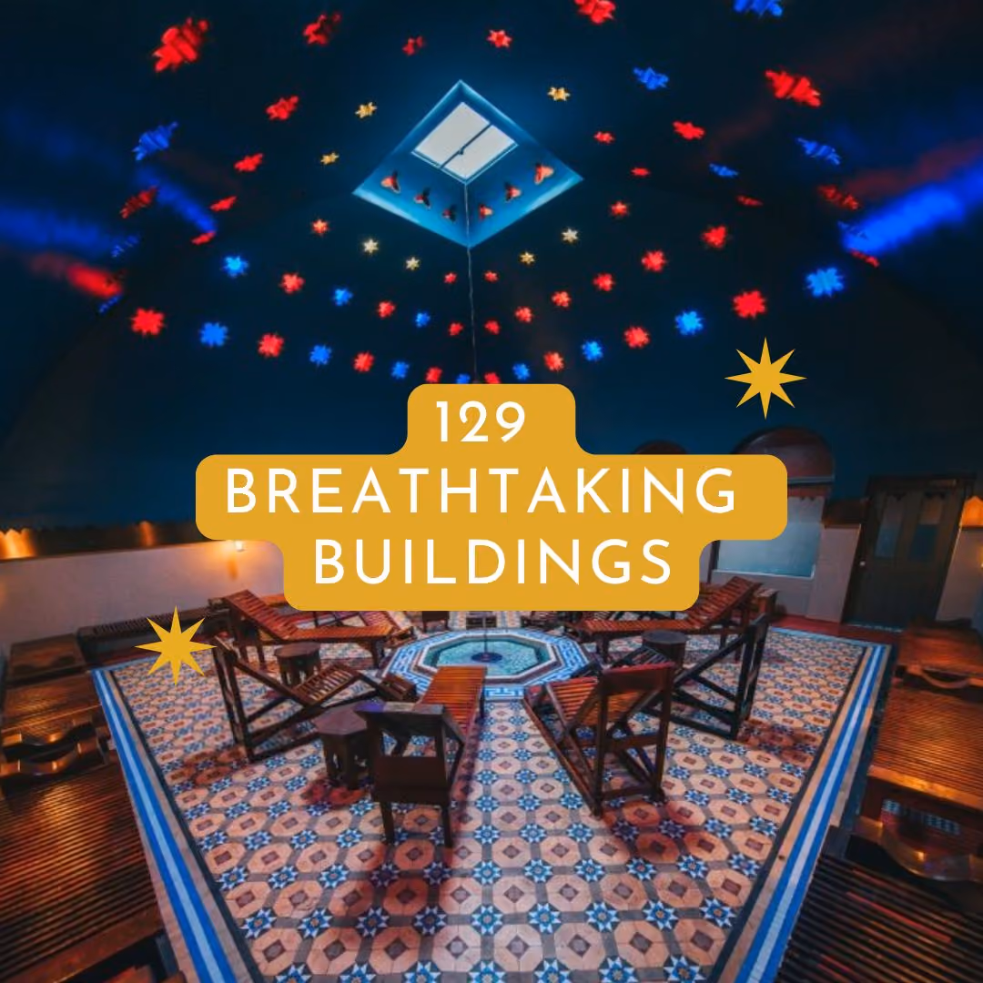 Colorful interior of a historic building with decorative lighting, patterned tile flooring, and traditional seating.
