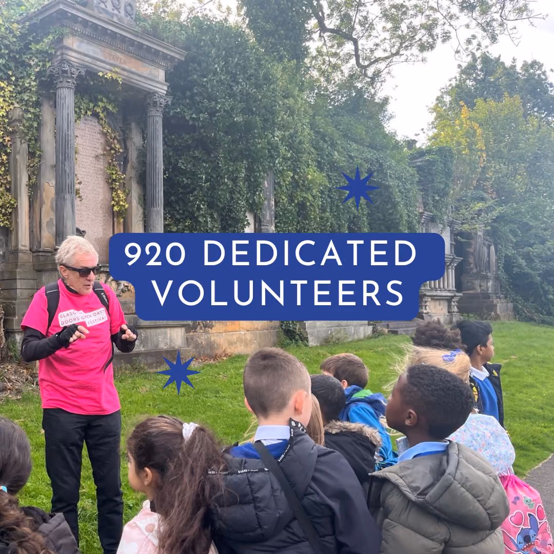 Children gathered with a volunteer guide in a historic cemetery during an educational outdoor tour.