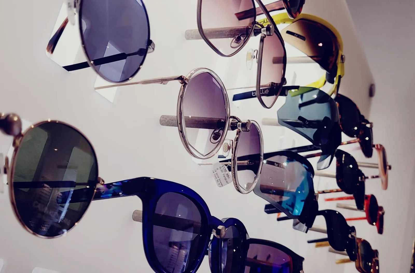 Wall display of sunglasses in store