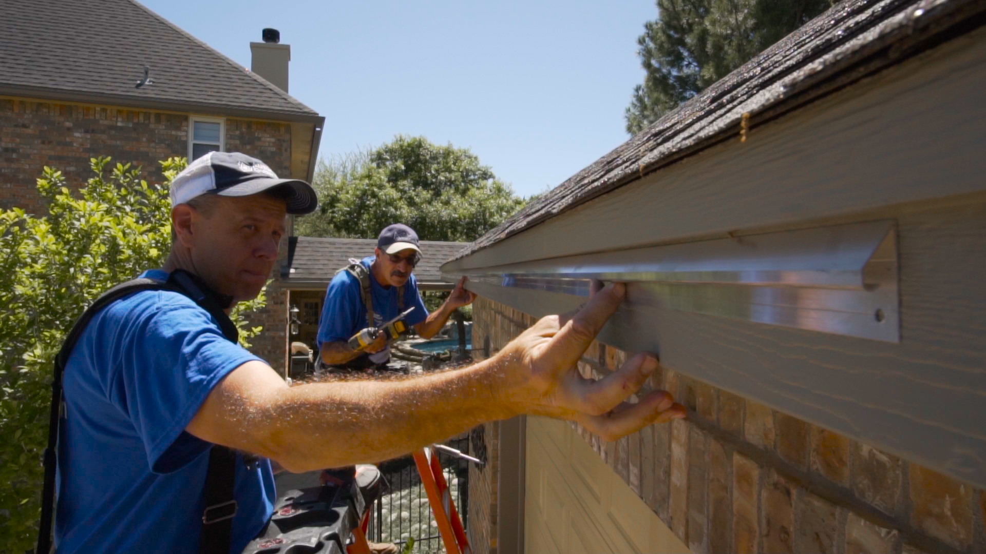 Clean seamless gutters installed on a residential roofline