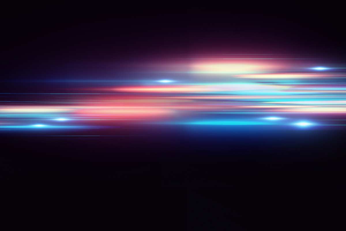 Abstract colored light streaks representing AI data flow