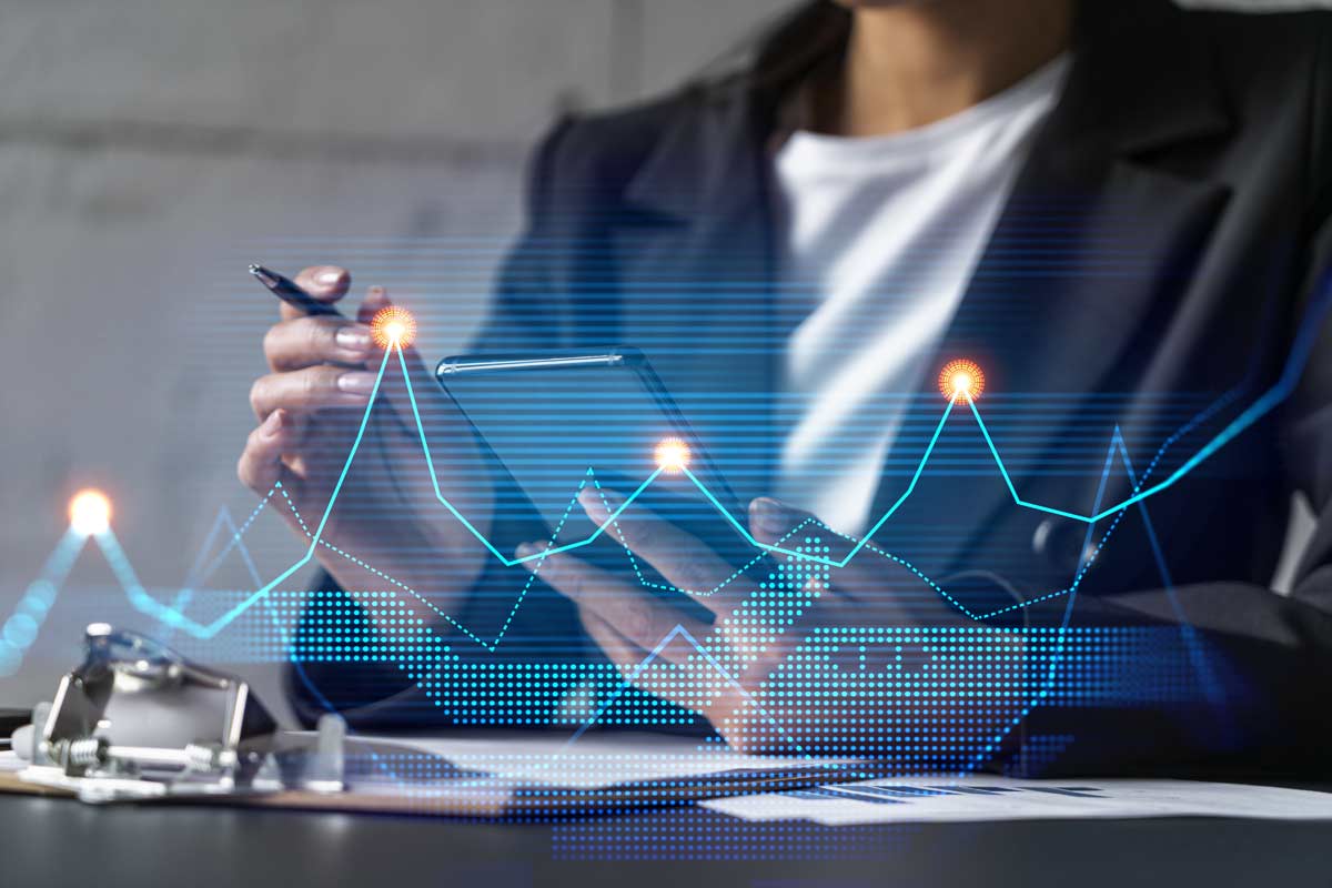 Business owner with budgeting graphs
