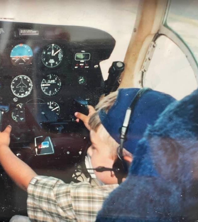 Image shows Andres as a young child in an aircraft cockpit.