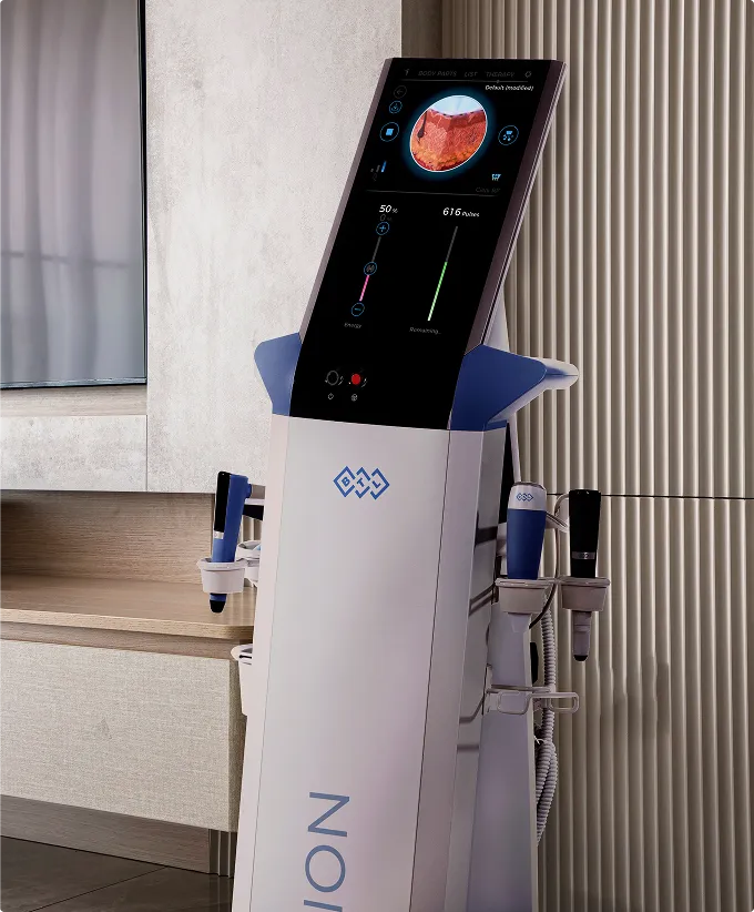 Medical device with a digital screen displaying a skin image and various control settings.