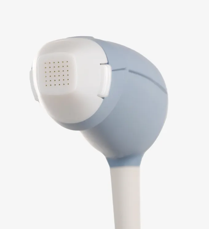 Close-up of a blue and white electronic device head with a grid of small holes.