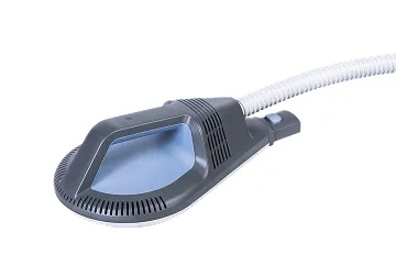 Black handheld device with a blue translucent window and attached flexible white tube.