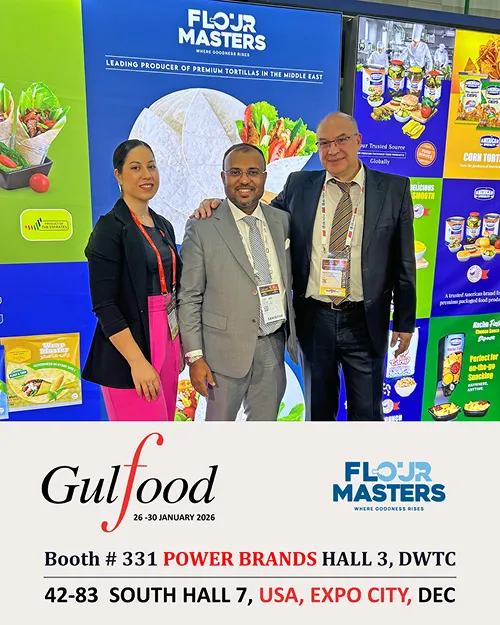 Three people in business attire at Flour Masters booth with Gulfood promotion text below.