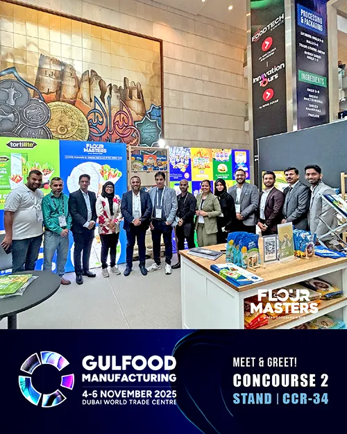 Group of people standing in front of Flour Masters booth at Gulfood Manufacturing 2025 event in Dubai.