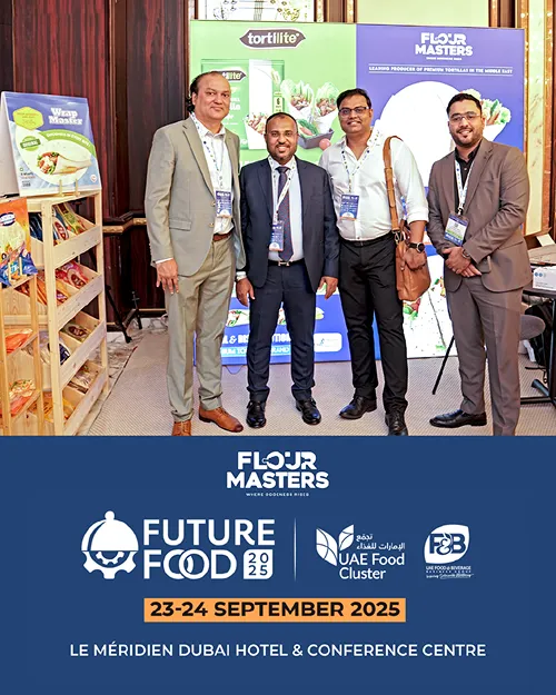 Four men in business attire posing at Future Food 2025 event at Le Méridien Dubai Hotel.