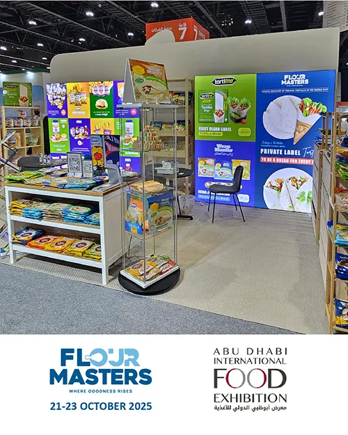 Booth displaying Flour Masters products with tortilla packaging at Abu Dhabi International Food Exhibition 2025.