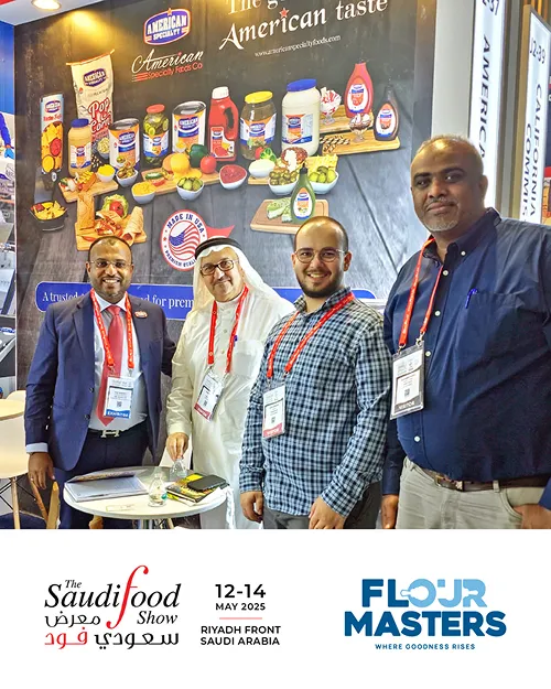 Four men standing in front of a display of American Specialty Foods products at Saudi Food Show 2025.