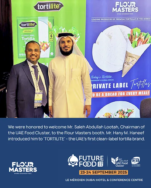 Two men stand in front of Tortilite and Flour Masters banners at Future Food 2025 event in Dubai.