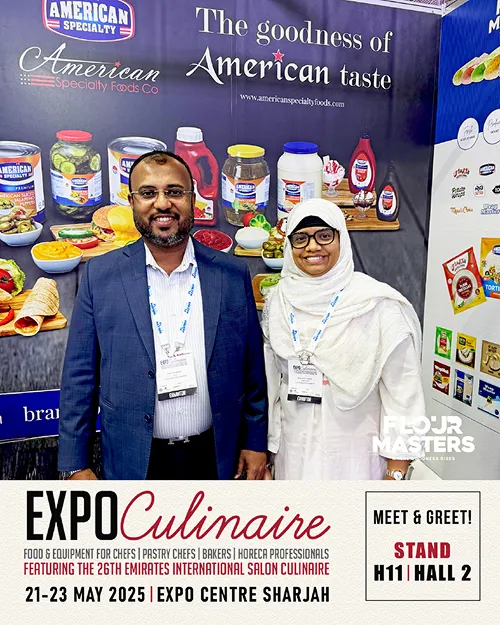 Two people standing in front of American Specialty Foods exhibition booth at Expo Culinaire 2025.