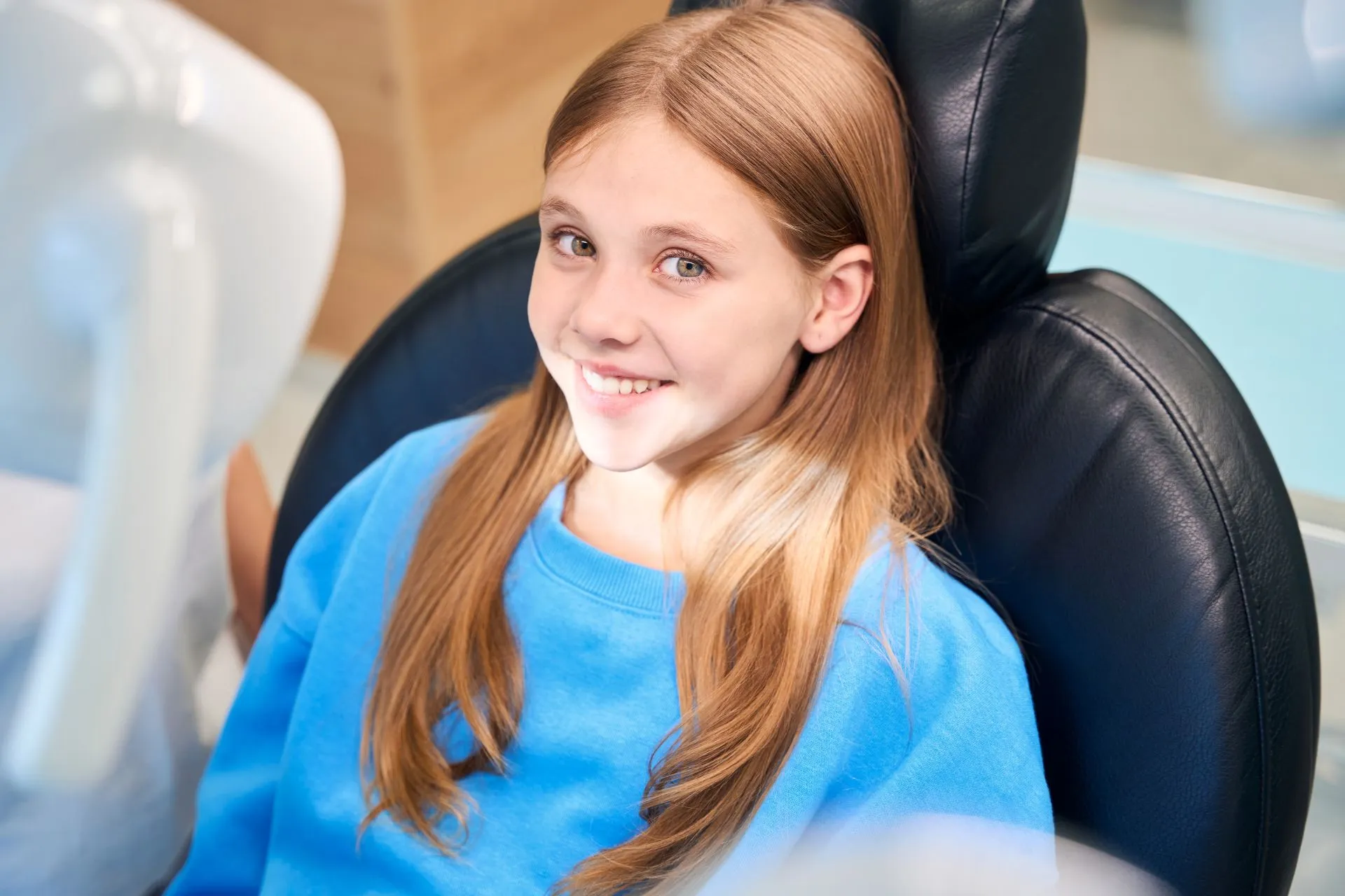 Dentist examining a patient's mouth to quickly assess and treat a dental emergency at Nova Dental Care of Chantilly
