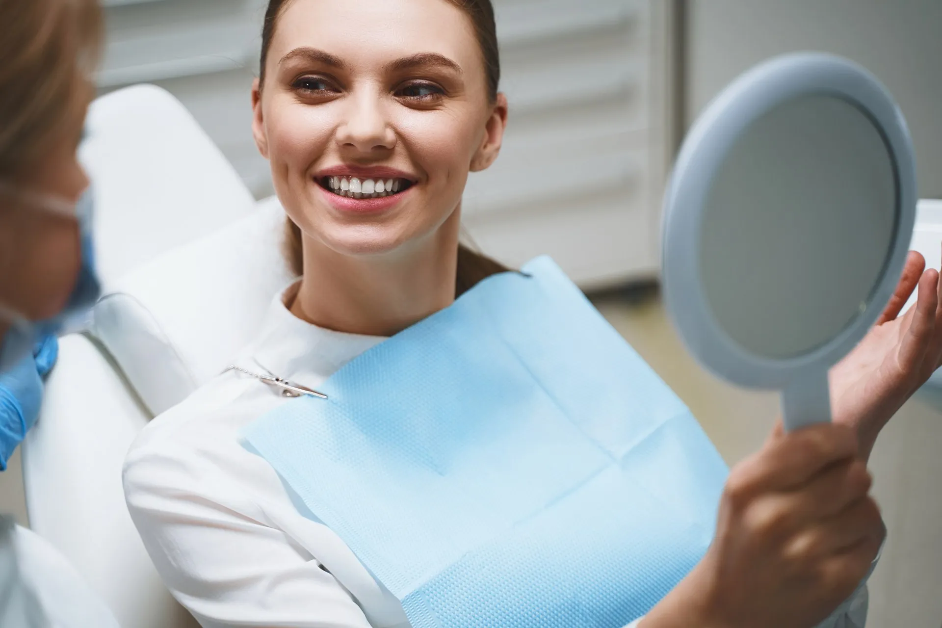 Dentist placing a tooth-colored composite filling to repair a cavity at Nova Dental Care of Chantilly
