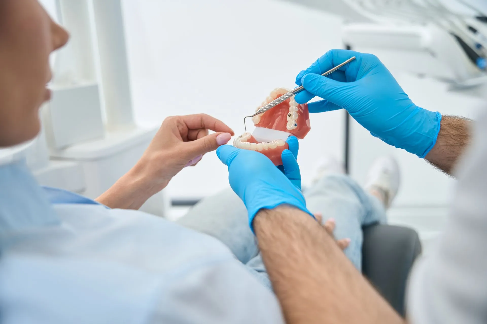 Dentist preparing teeth for a dental bridge restoration at Nova Dental Care of Chantilly