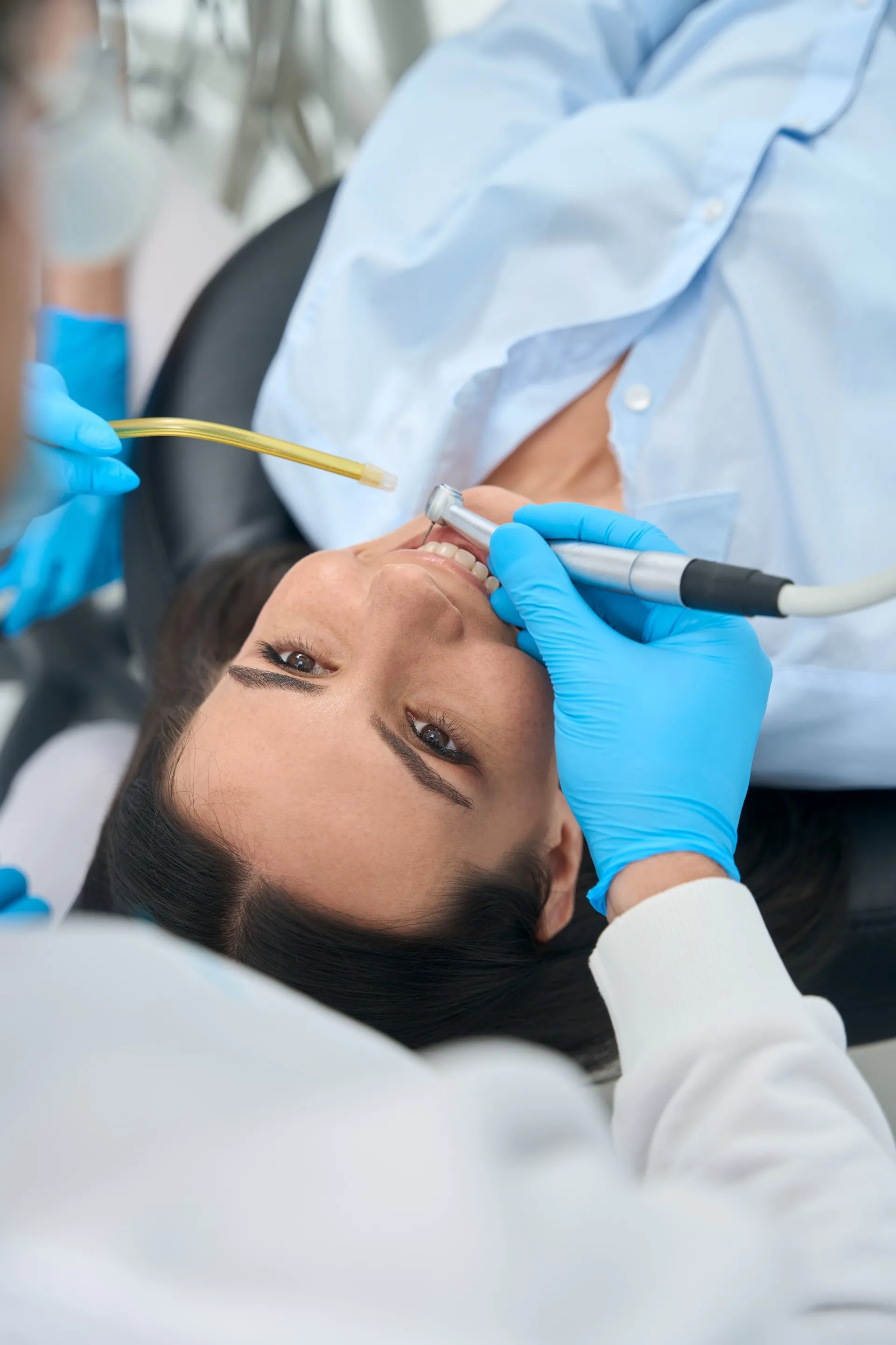 Dentist performing a root canal procedure using modern rotary instruments and digital imaging