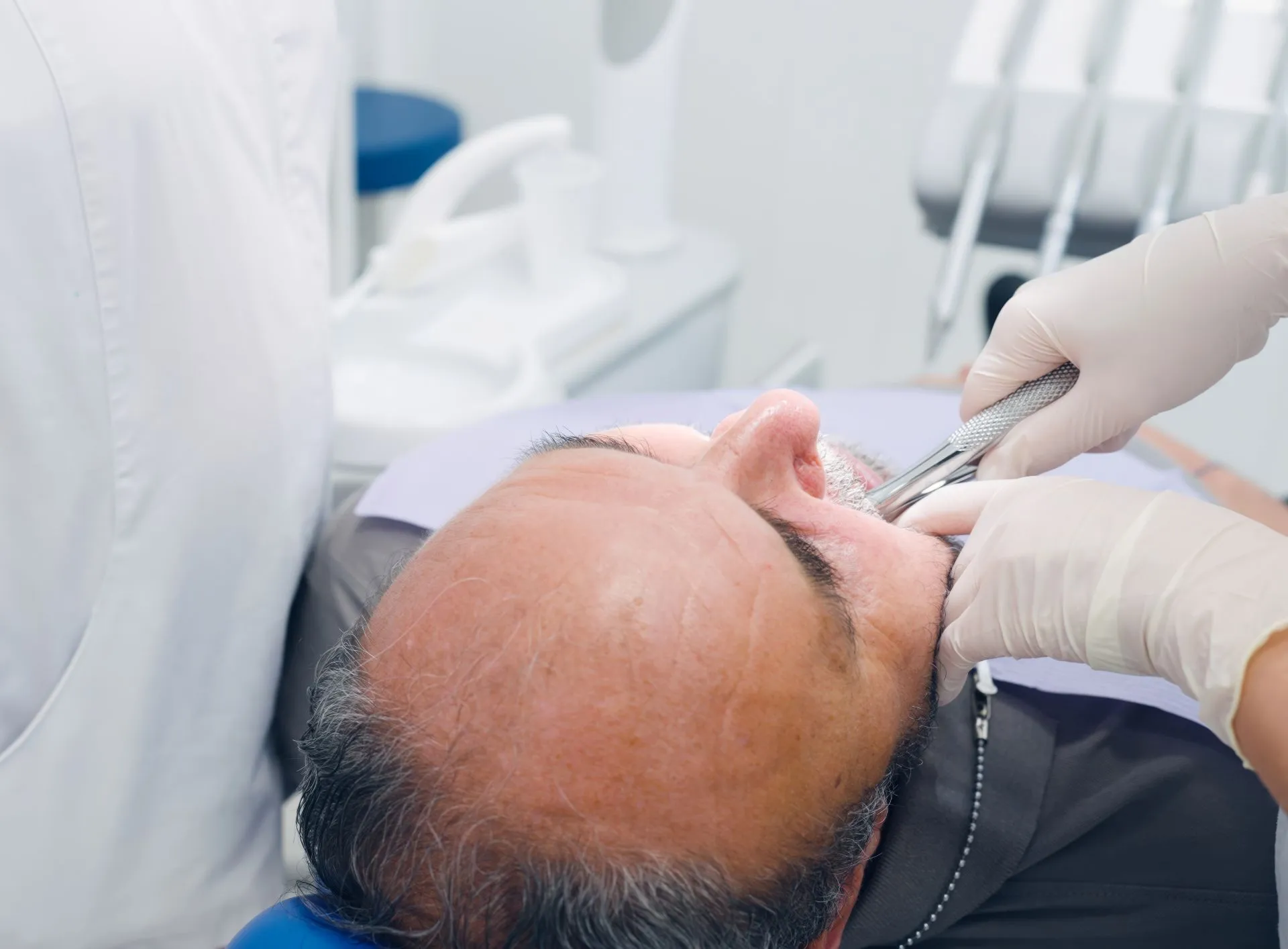Dental instruments used during a careful tooth extraction at Nova Dental Care of Chantilly