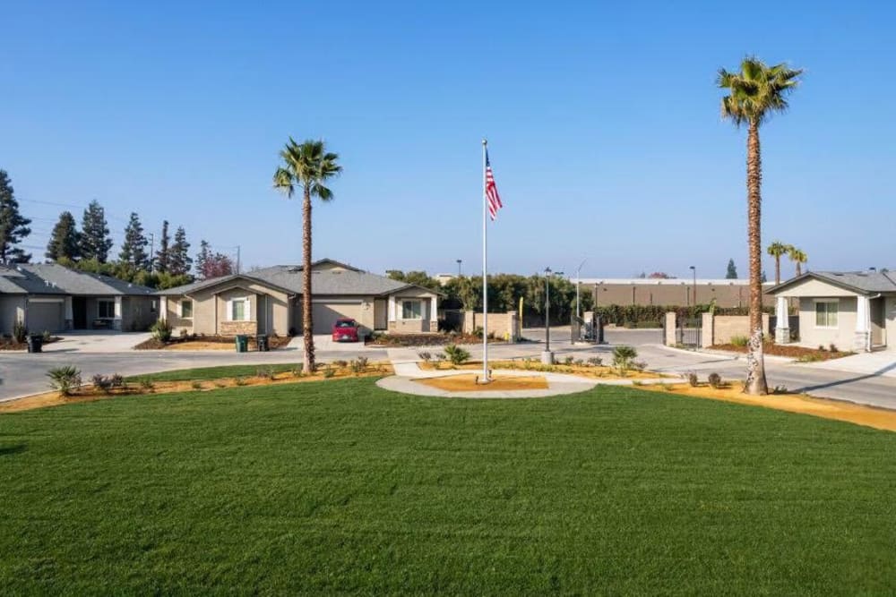 Exterior of townhomes with flag