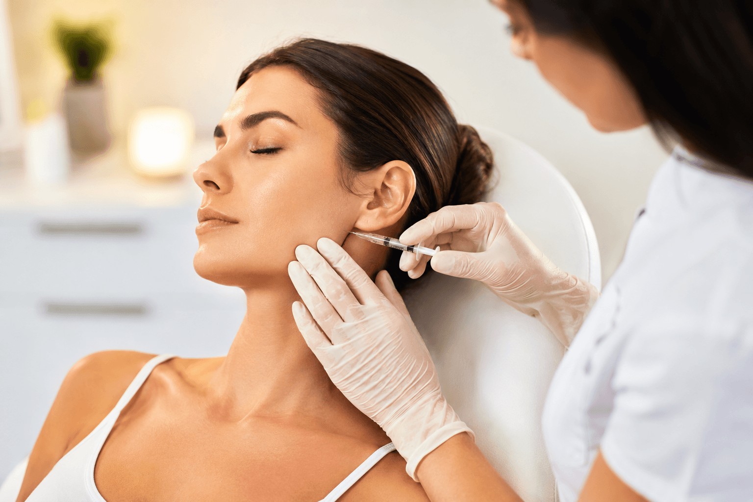 Botox treatment for TMJ pain and jaw tension at a medical aesthetics clinic in Reston, Virginia helping reduce teeth grinding and facial discomfort.