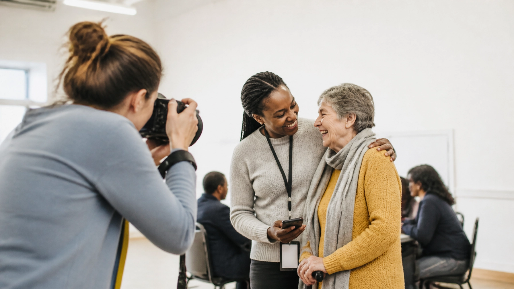 A professional photographer capturing a candid moment between a charity worker and a community member.